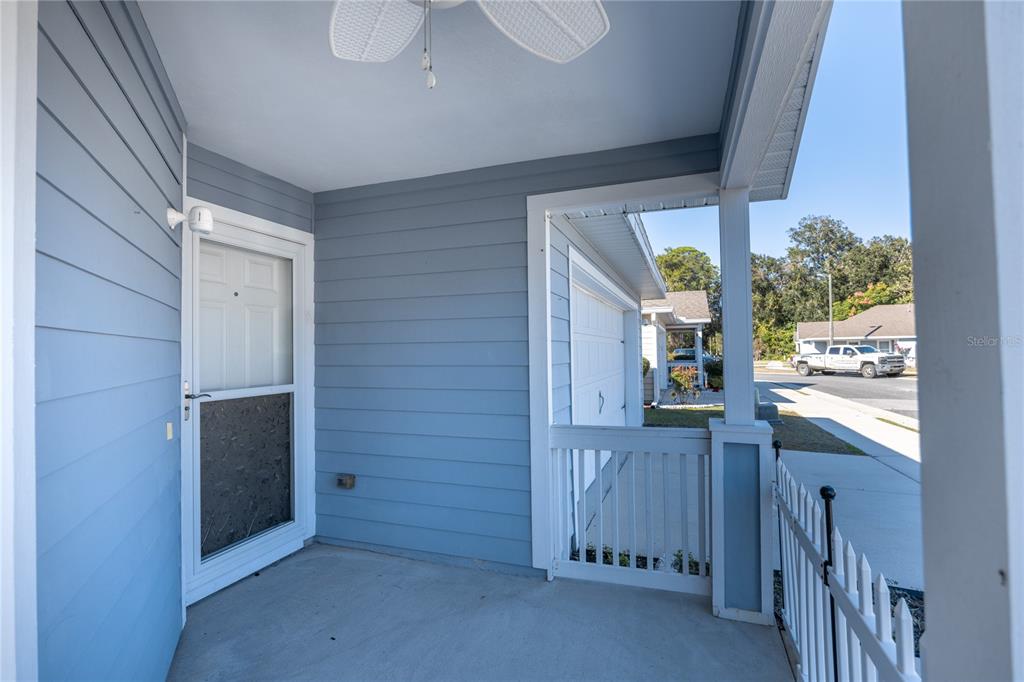 470 Southwest 251st Street Newberry, FL 32669 - Photo 4 of 33 a view of a hallway to an empty room with wooden floor and a window