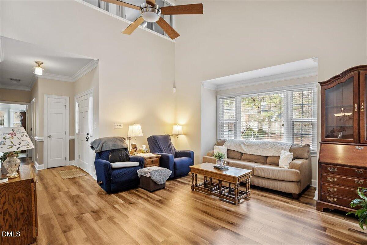 126 Skylark Way Raleigh, NC 27615 - Photo 8 of 29 a living room with furniture and a large window