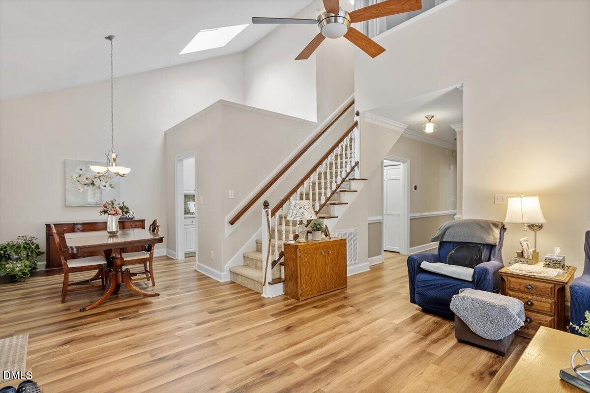 126 Skylark Way Raleigh, NC 27615 - Photo 9 of 29 a living room with furniture and a wooden floor