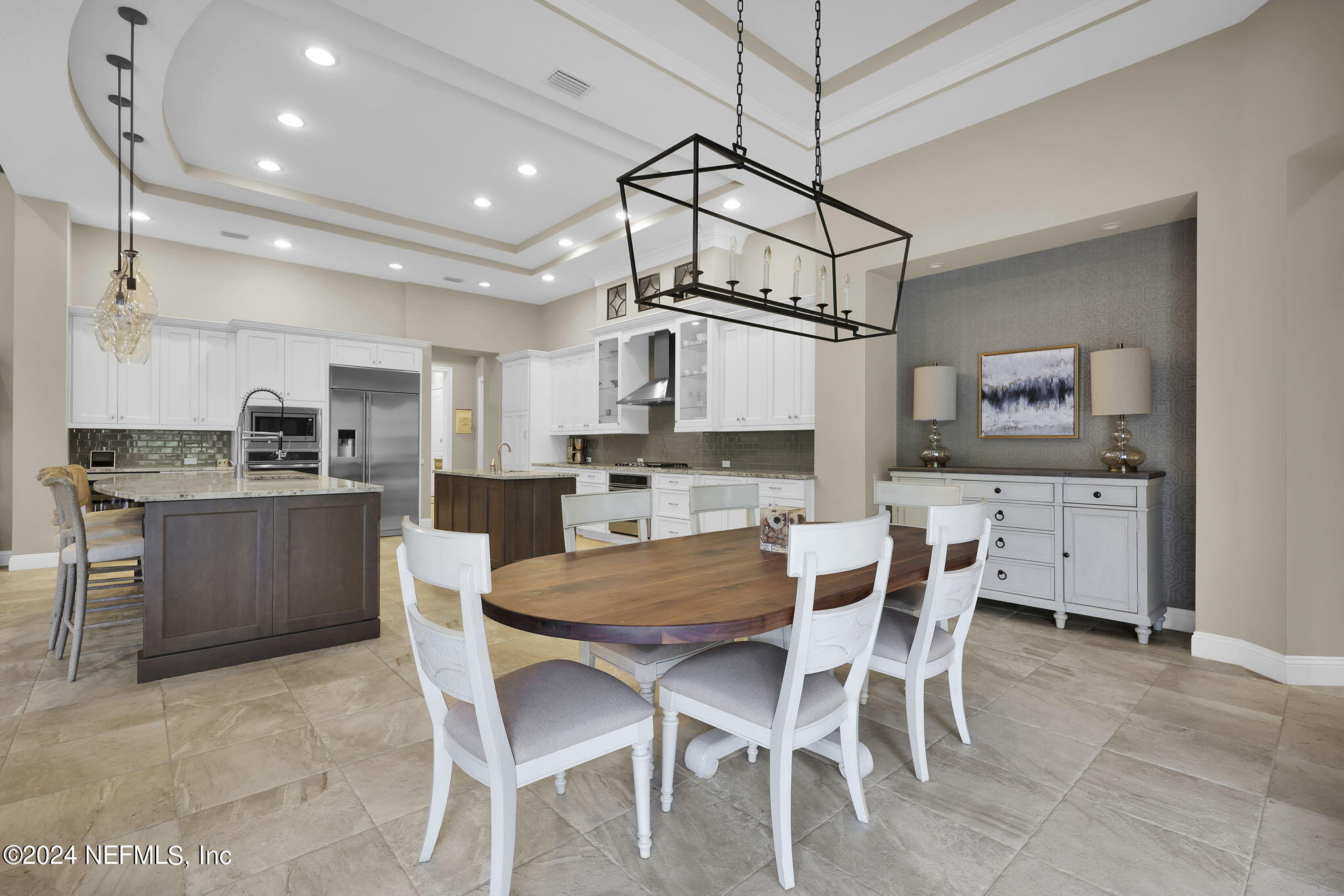 125 Senora Court St. Augustine, FL 32095 - Photo 21 of 109 a view of a dining room and kitchen with a chandelier
