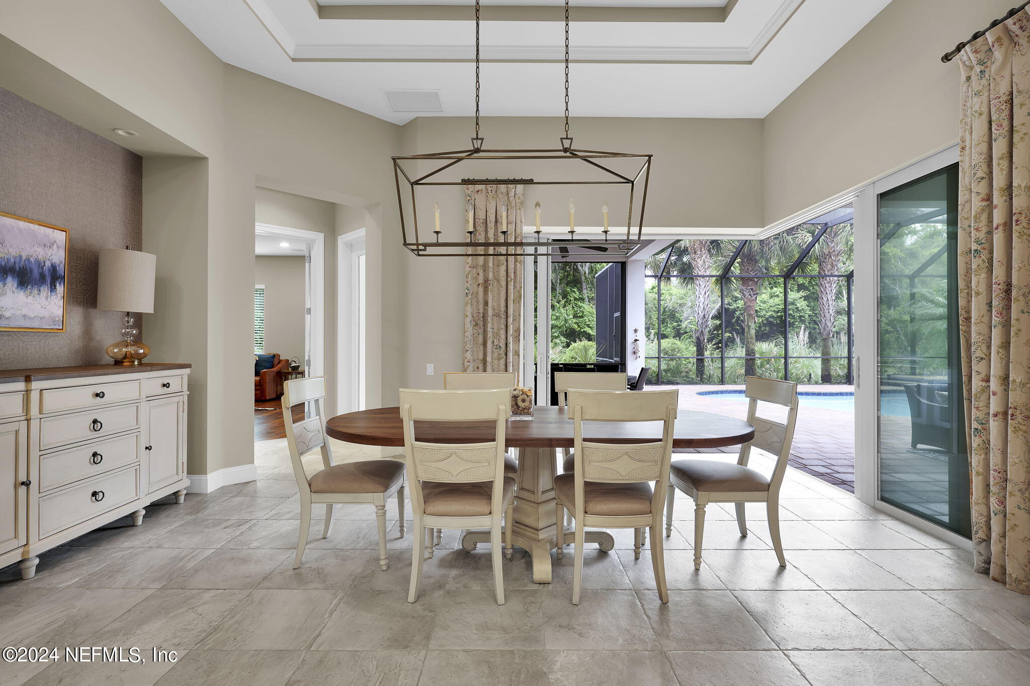 125 Senora Court St. Augustine, FL 32095 - Photo 22 of 109 a view of a dining room with furniture large windows and wooden floor