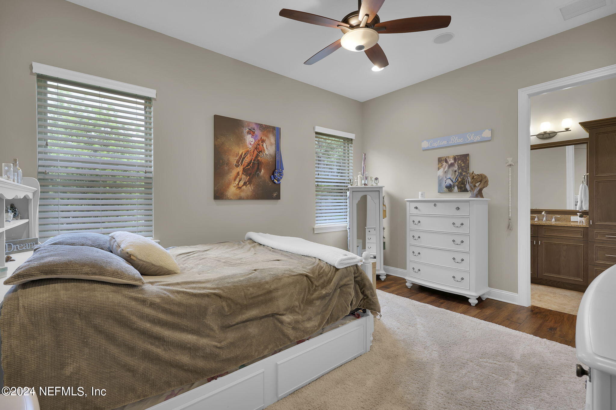 125 Senora Court St. Augustine, FL 32095 - Photo 50 of 109 a bedroom with a bed and a chandelier