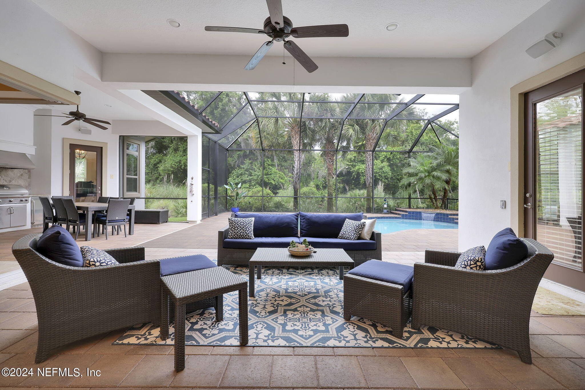 125 Senora Court St. Augustine, FL 32095 - Photo 52 of 109 a living room with patio furniture and a potted plants