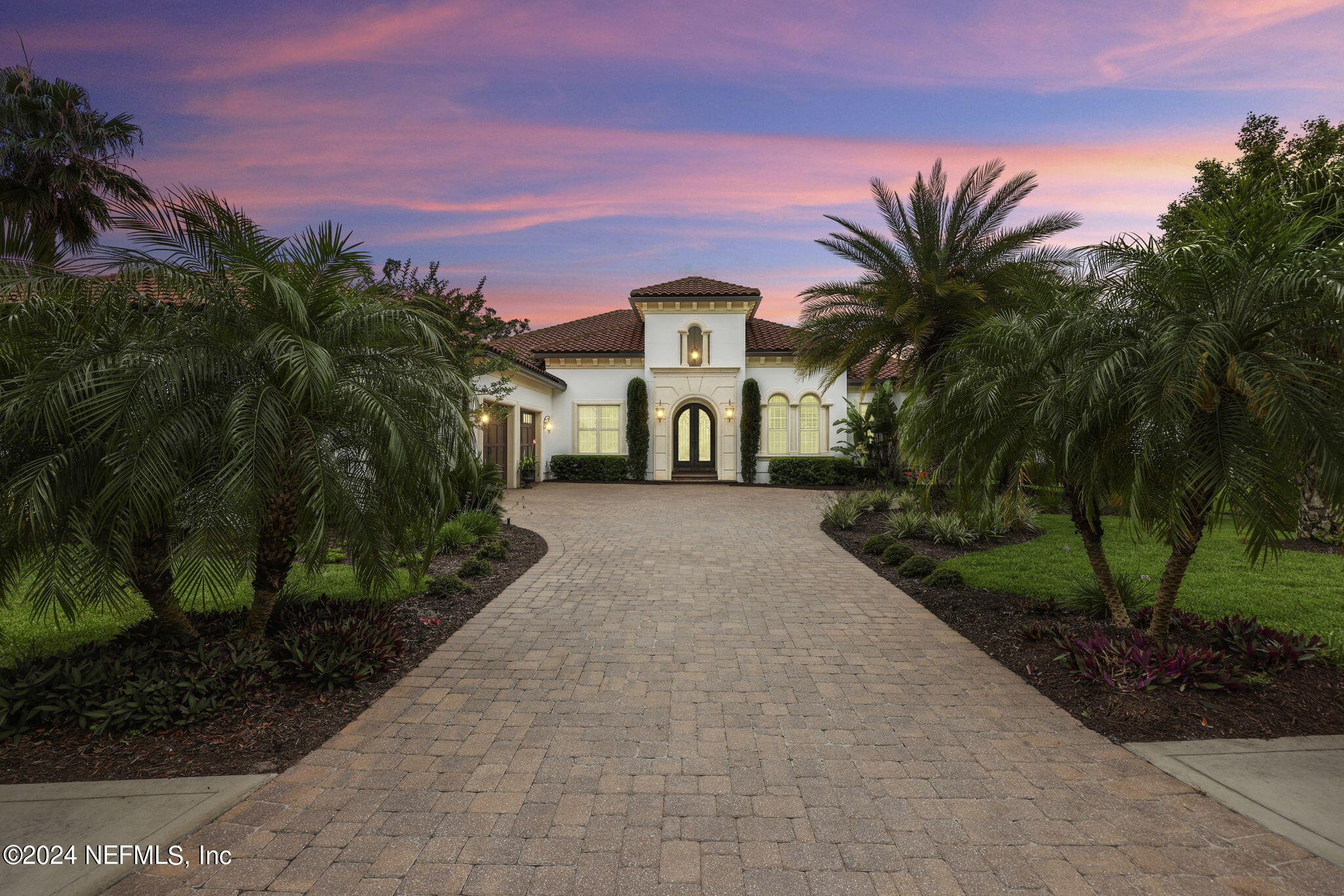 125 Senora Court St. Augustine, FL 32095 - Photo 68 of 109 a front view of a house with a yard and a garage