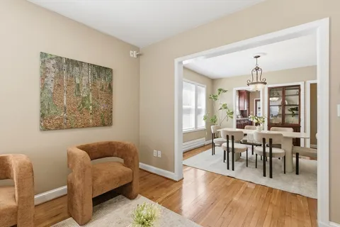 a view of a dining room with furniture window and wooden floor