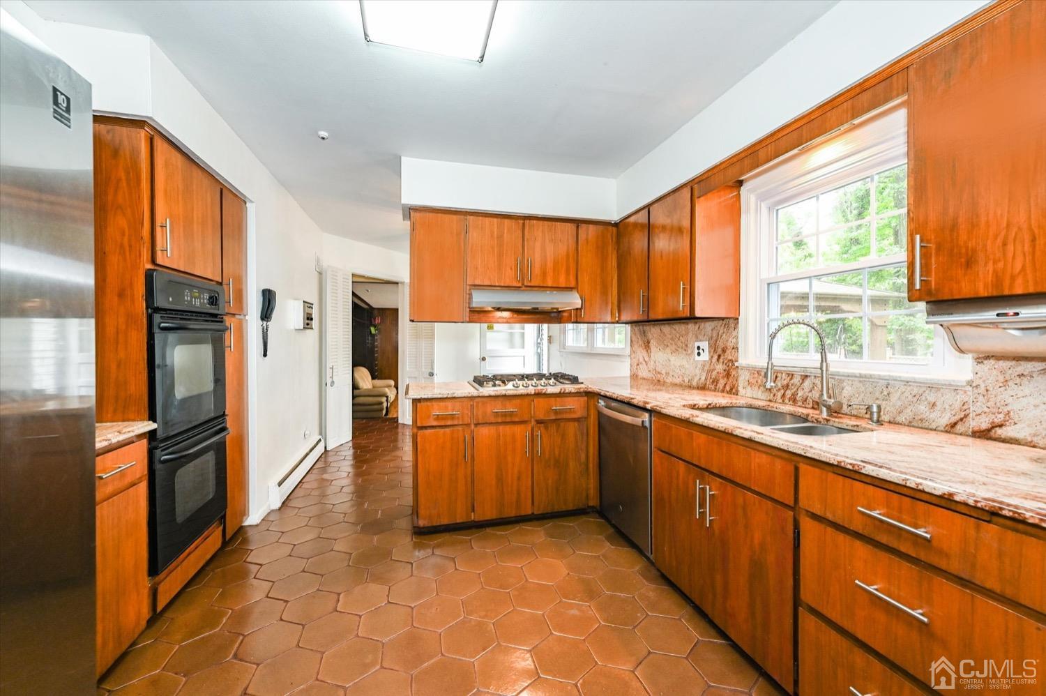 50 Clive Hills Road Edison, NJ 08820 - Photo 13 of 32 a kitchen with stainless steel appliances granite countertop a refrigerator and a sink