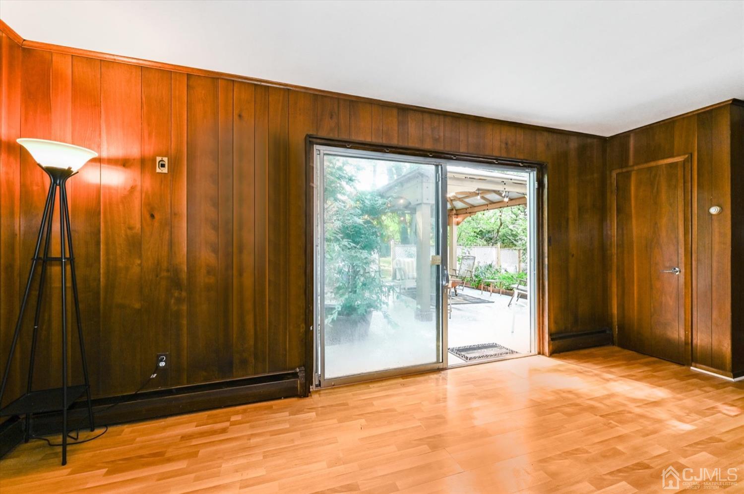50 Clive Hills Road Edison, NJ 08820 - Photo 17 of 32 a view of empty room with wooden floor and fan