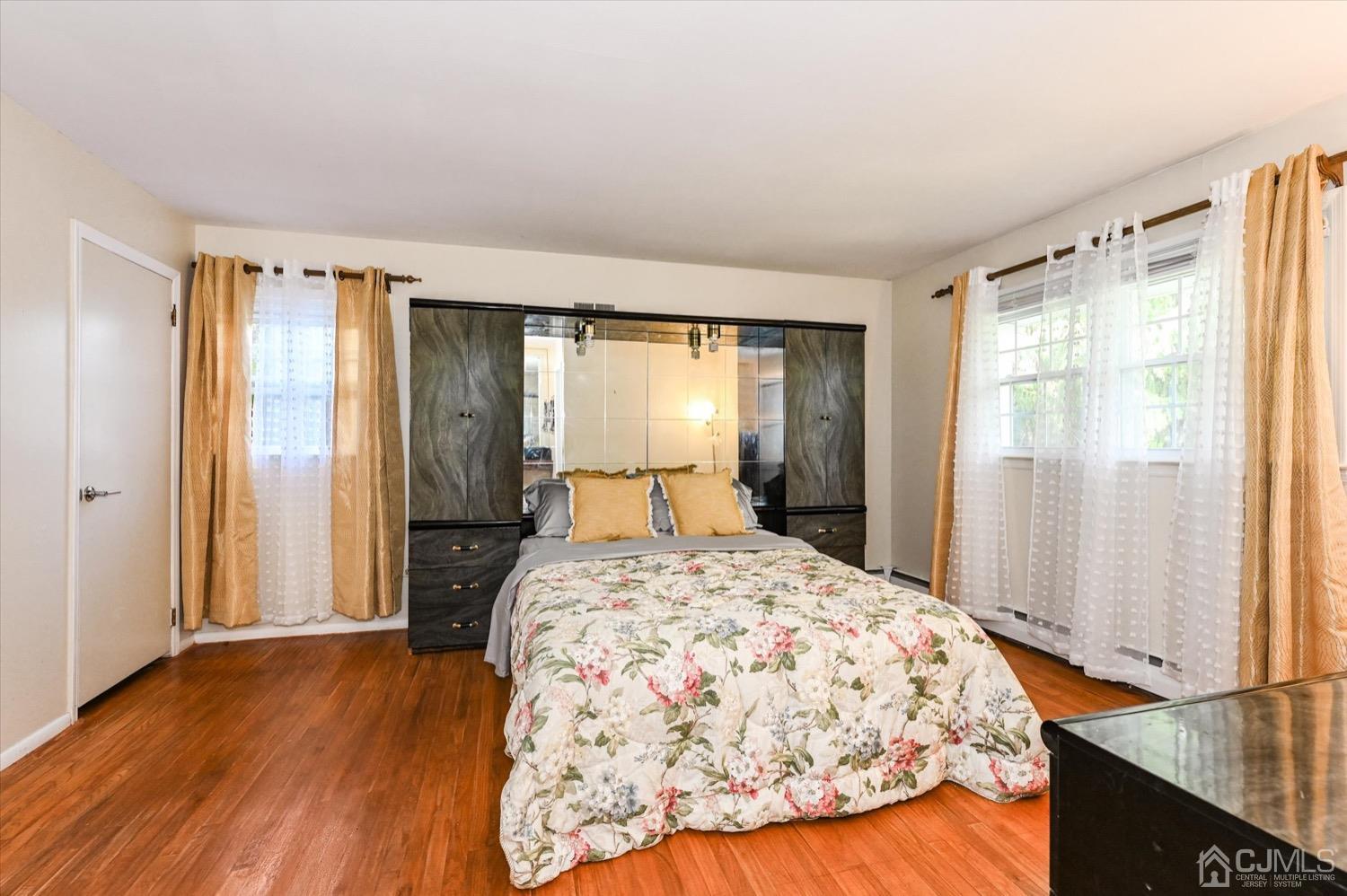 50 Clive Hills Road Edison, NJ 08820 - Photo 18 of 32 a bedroom with a large bed and a window