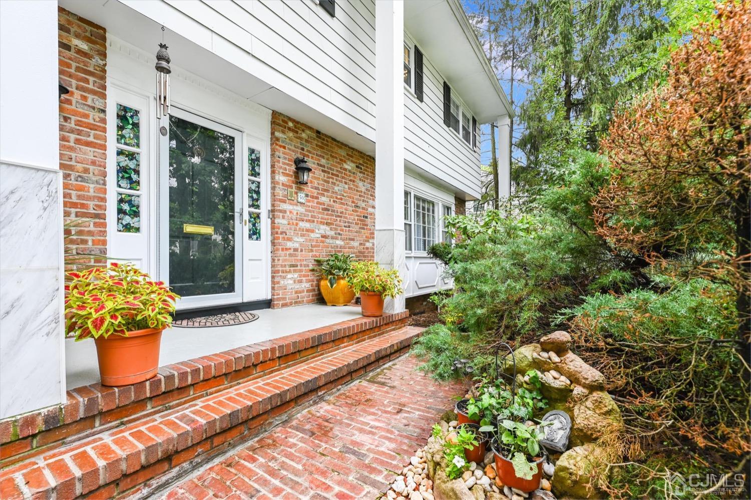 50 Clive Hills Road Edison, NJ 08820 - Photo 2 of 32 a front view of a house with outdoor seating