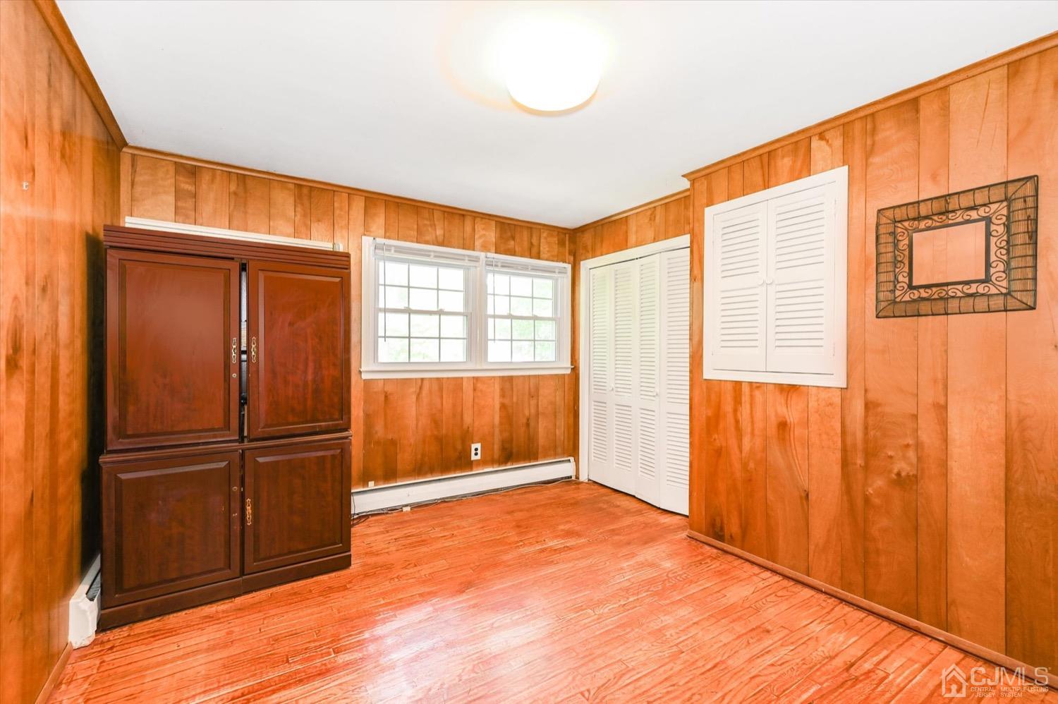 50 Clive Hills Road Edison, NJ 08820 - Photo 23 of 32 a view of an empty room with wooden floor and a window