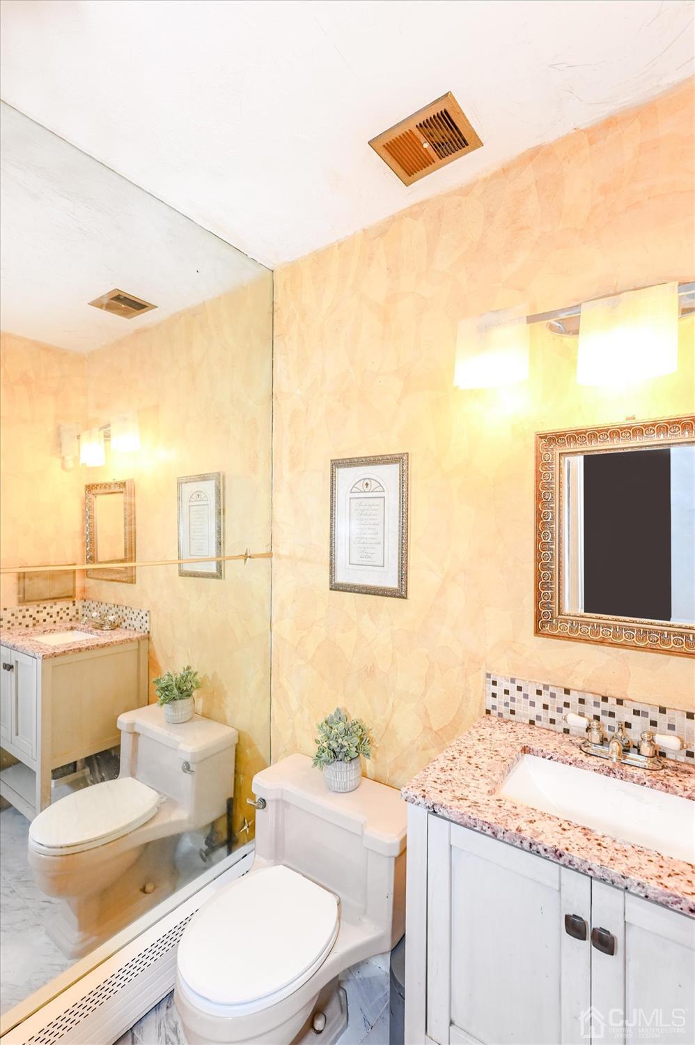 50 Clive Hills Road Edison, NJ 08820 - Photo 25 of 32 a bathroom with a granite countertop sink mirror vanity and toilet