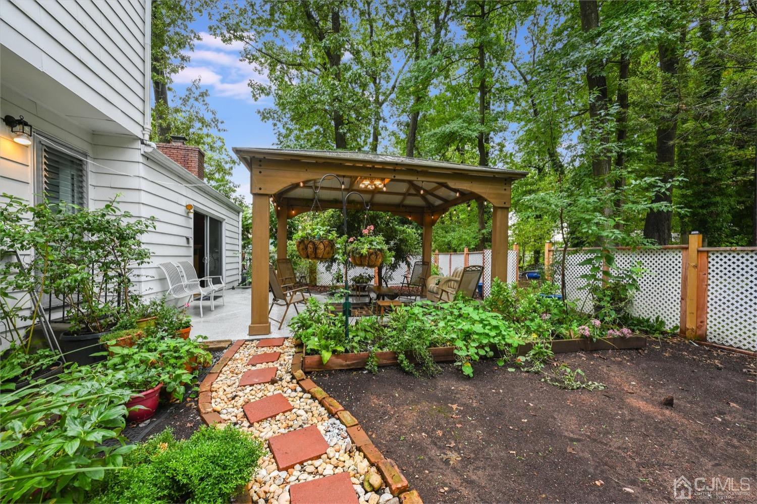 50 Clive Hills Road Edison, NJ 08820 - Photo 5 of 32 front view of a house with garden