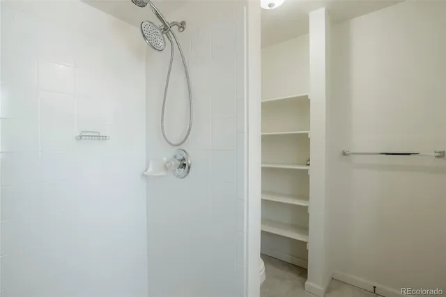 a view of a porch with wooden floor and fence