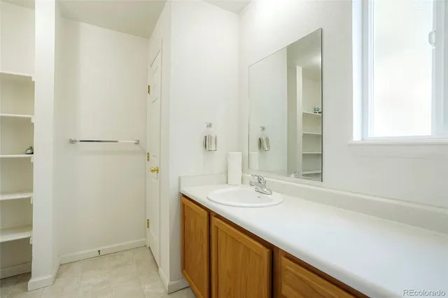 a view of a house with a large tree