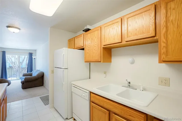 a bedroom with two beds and a dresser