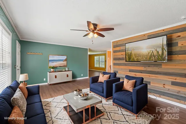 a living room with furniture and a flat screen tv