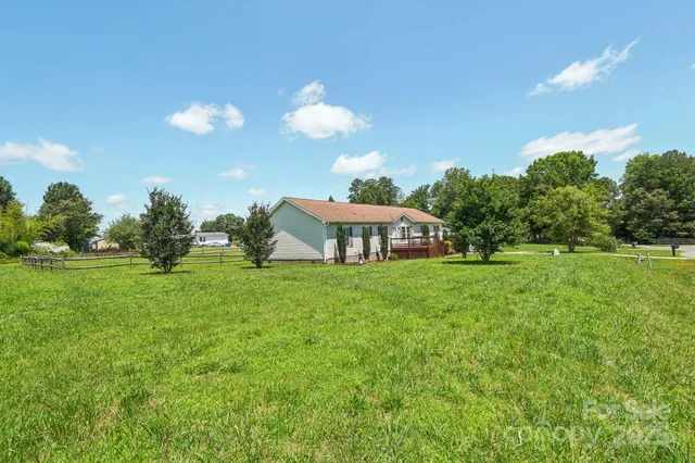 a view of a house with a big yard