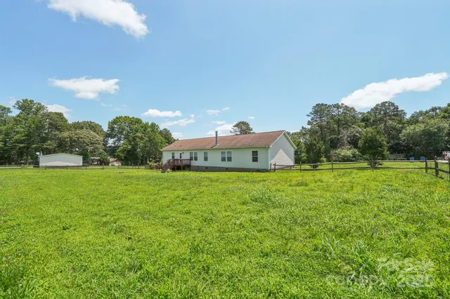 a front view of house with yard and seating area