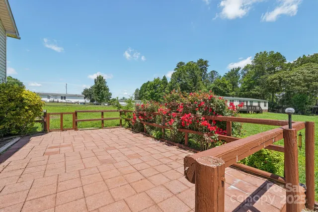 a view of a backyard with sitting area