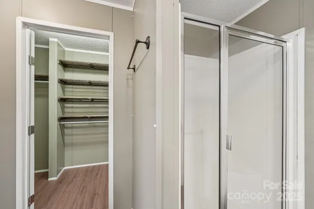 a bathroom with a glass shower door