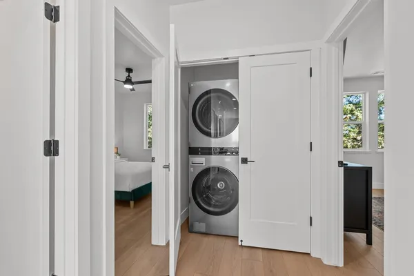 a view of a hallway with washer and dryer