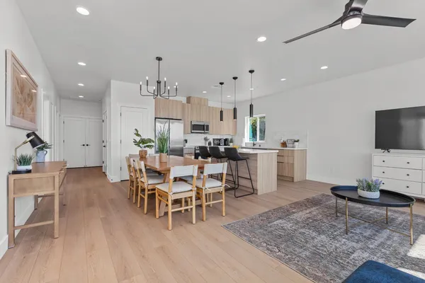 a living room with furniture and kitchen view