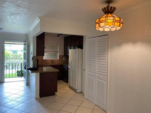 1291 Northwest 13th Street, Unit 445D Boca Raton, FL 33486 - Photo 5 of 11 kitchen/living