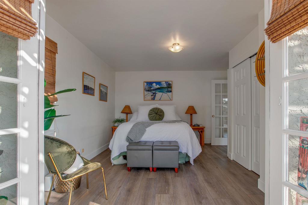 906 Leonard Avenue Oceanside, CA 92054 - Photo 19 of 53 a bedroom with a bed and a table in it