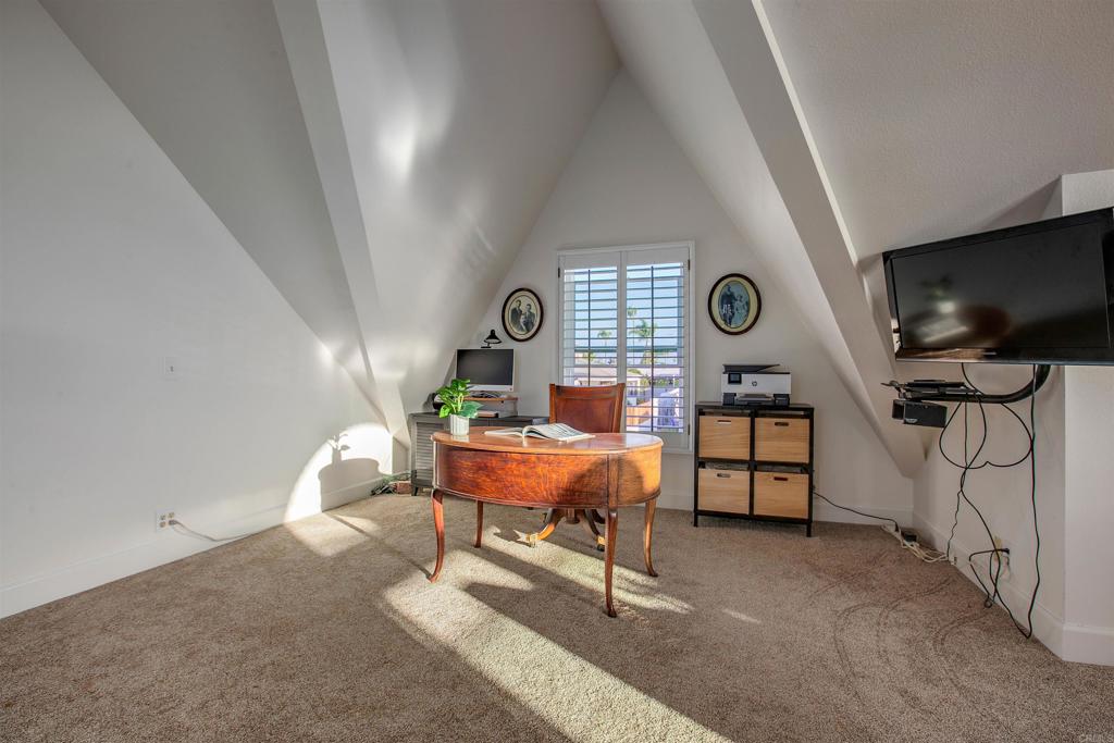 906 Leonard Avenue Oceanside, CA 92054 - Photo 29 of 53 a living room with furniture and a flat screen tv