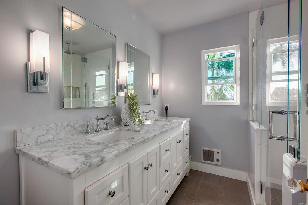 906 Leonard Avenue Oceanside, CA 92054 - Photo 34 of 53 a bathroom with a granite countertop sink and a mirror
