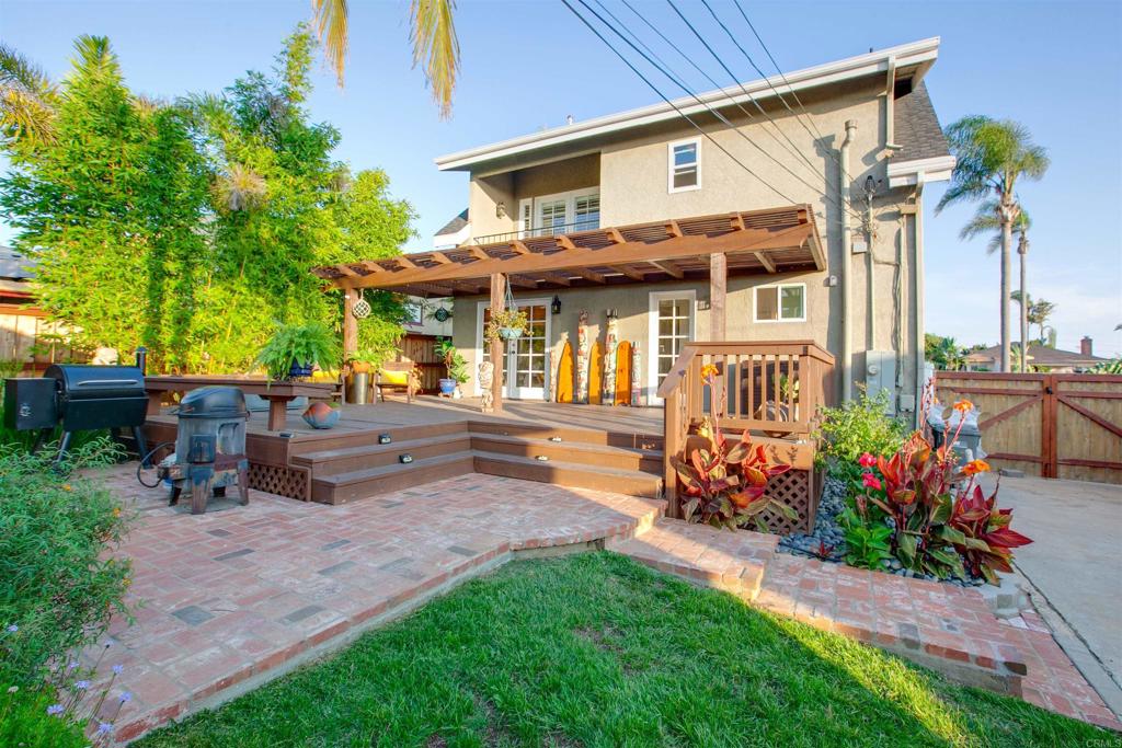 906 Leonard Avenue Oceanside, CA 92054 - Photo 46 of 53 a front view of a house with a yard table and chairs