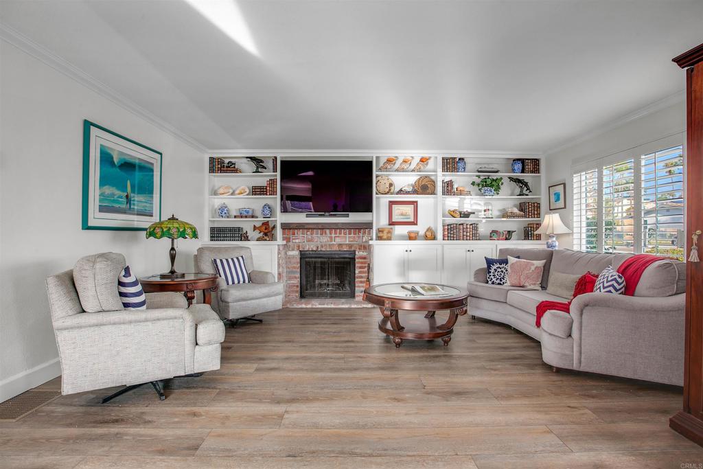 906 Leonard Avenue Oceanside, CA 92054 - Photo 7 of 53 a living room with furniture flat screen tv and a fireplace