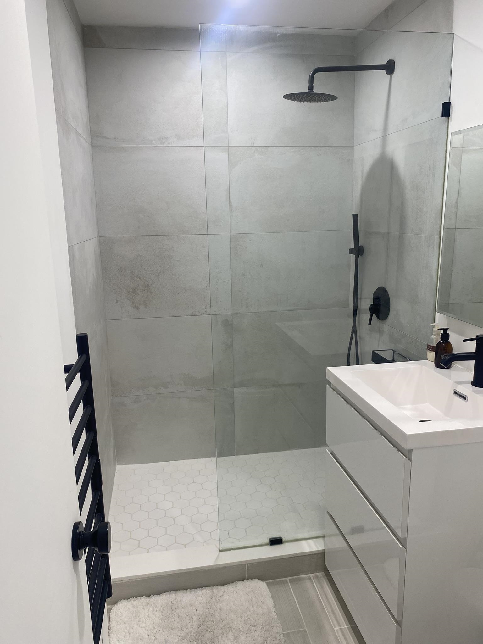 6010 Boulevard East West New York, NJ 07093 - Photo 14 of 27 a bathroom with a sink a toilet and shower