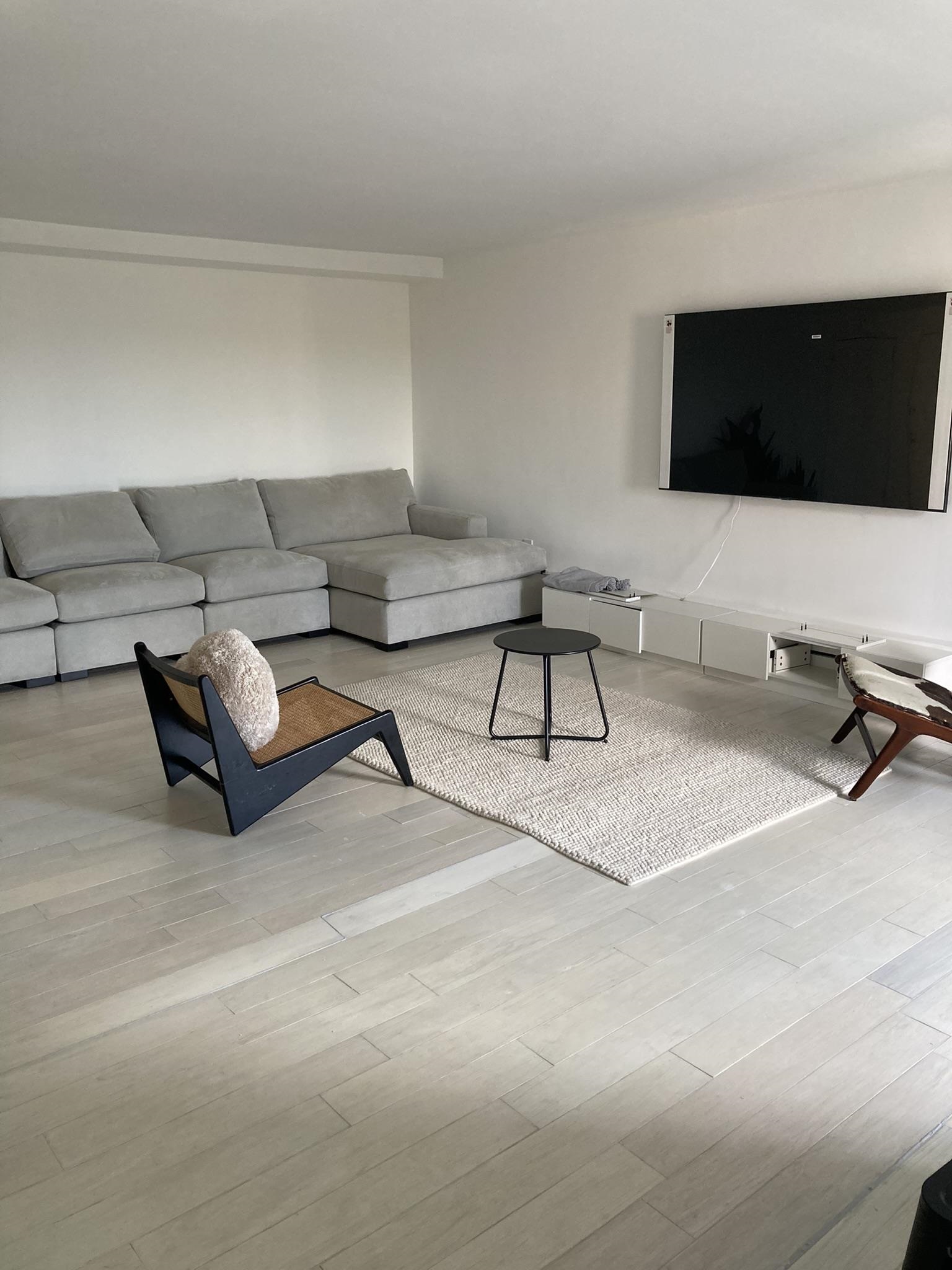 6010 Boulevard East West New York, NJ 07093 - Photo 19 of 27 a living room with furniture and a flat screen tv
