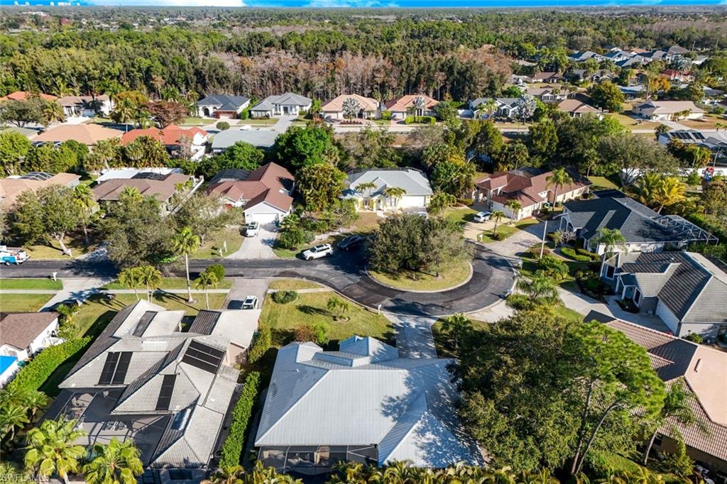 302 Sawgrass Court Naples, FL 34110 - Photo 31 of 40 an aerial view of residential houses with outdoor space