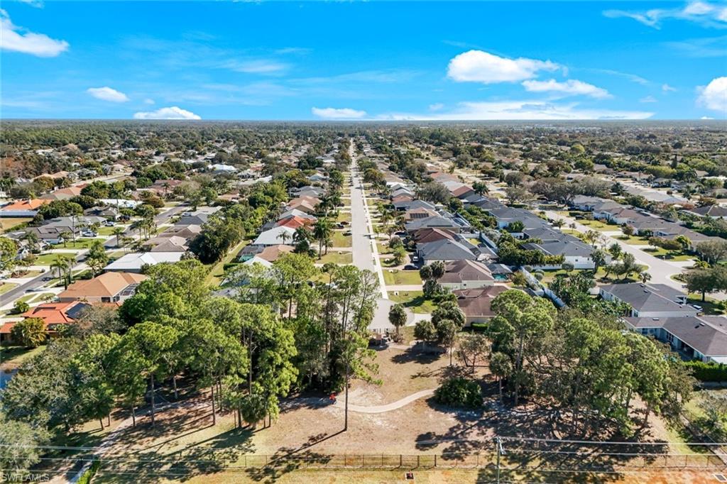 302 Sawgrass Court Naples, FL 34110 - Photo 34 of 40 an aerial view of multiple house