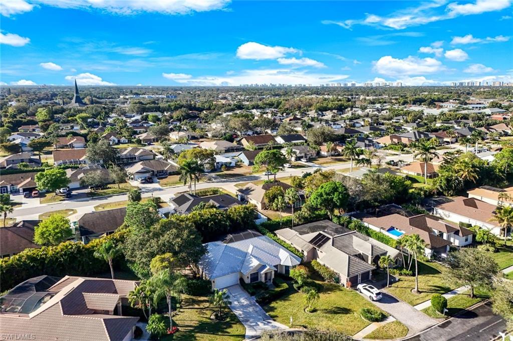 302 Sawgrass Court Naples, FL 34110 - Photo 35 of 40 an aerial view of a city