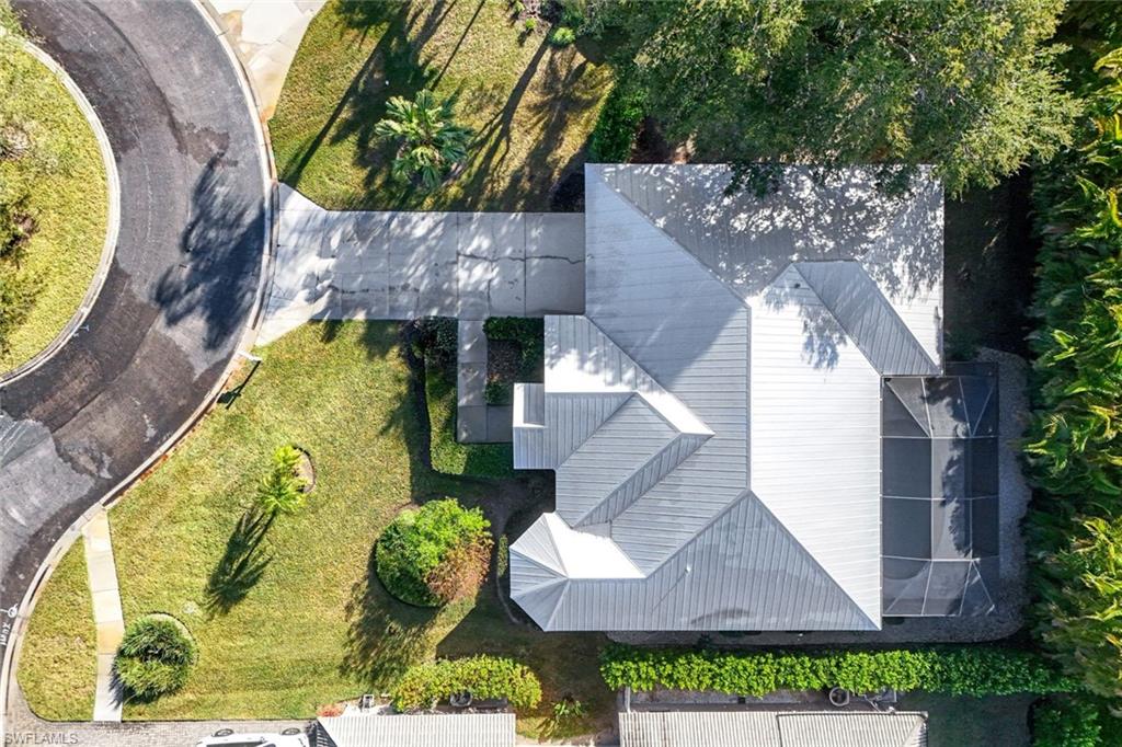 302 Sawgrass Court Naples, FL 34110 - Photo 36 of 40 an aerial view of a house with a swimming pool