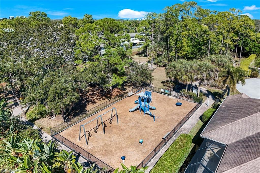 302 Sawgrass Court Naples, FL 34110 - Photo 39 of 40 swimming pool view with a seating space