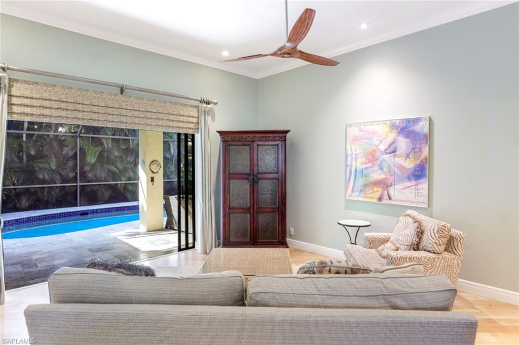 302 Sawgrass Court Naples, FL 34110 - Photo 6 of 40 a living room with furniture and window