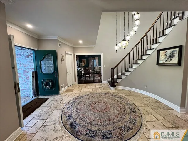 a view of a dining room with furniture large windows and wooden floor