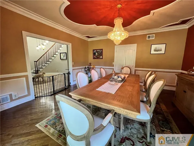 a kitchen with stainless steel appliances granite countertop a refrigerator and a stove