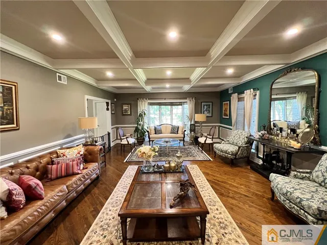 a kitchen with stainless steel appliances kitchen island granite countertop a stove a sink and a refrigerator