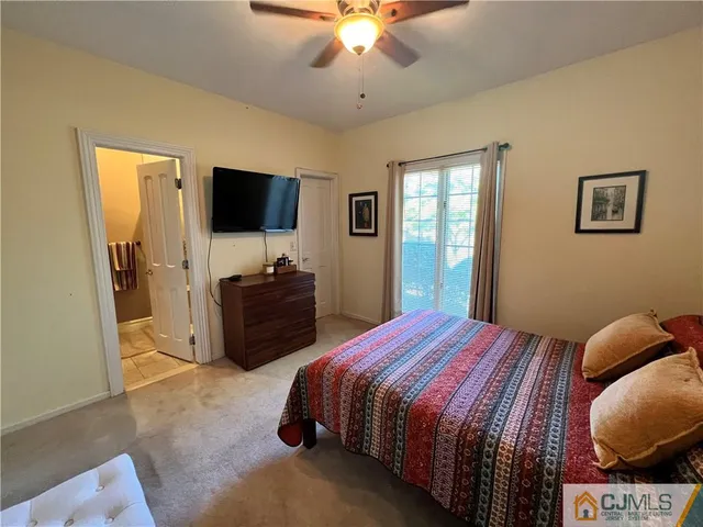 a bathroom with a toilet a sink and a mirror