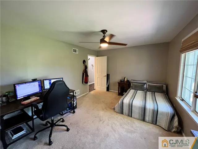 a bathroom with a sink toilet and mirror