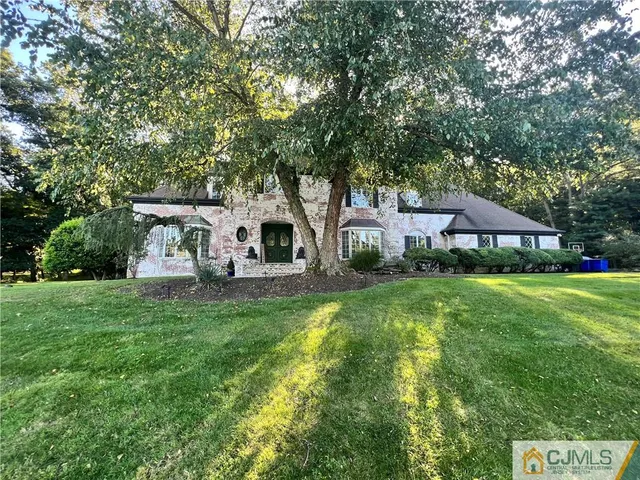 a view of a livingroom with furniture and staircase