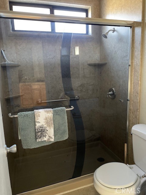 760 Blue Jay Road, Unit 48 Big Bear Lake, CA 92315 - Photo 12 of 31 a bathroom with a toilet and a shower