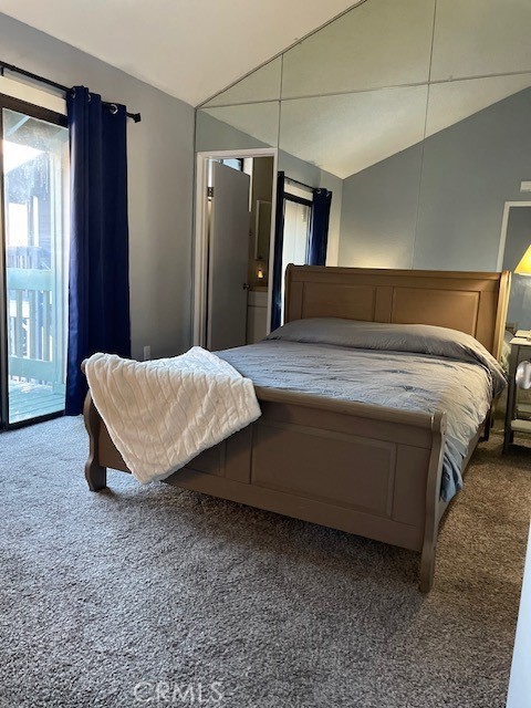 760 Blue Jay Road, Unit 48 Big Bear Lake, CA 92315 - Photo 5 of 31 a spacious bedroom with a bed and wooden floor