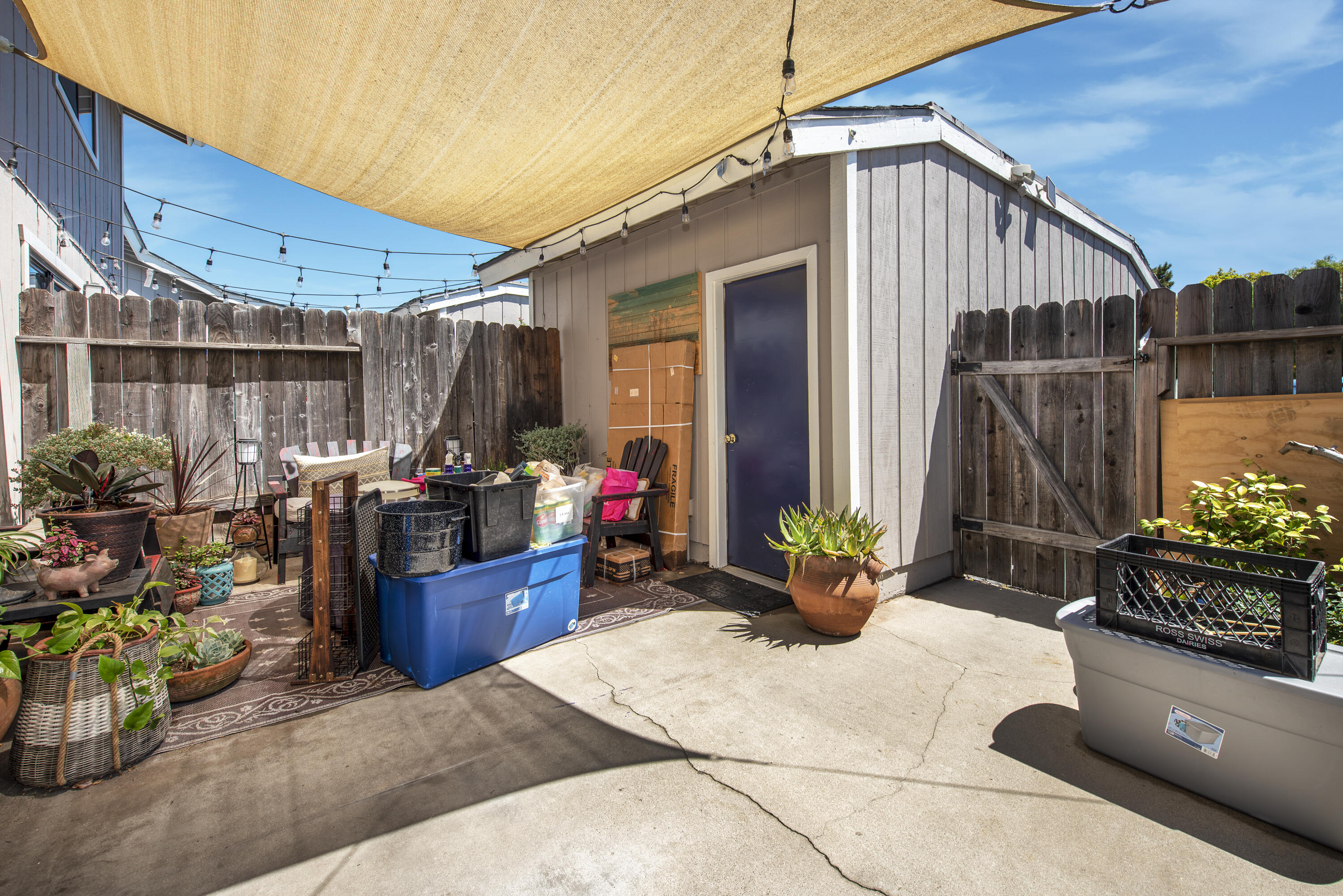 214 North R Street Lompoc, CA 93436 - Photo 13 of 15 a view of a patio with table and chairs potted plants