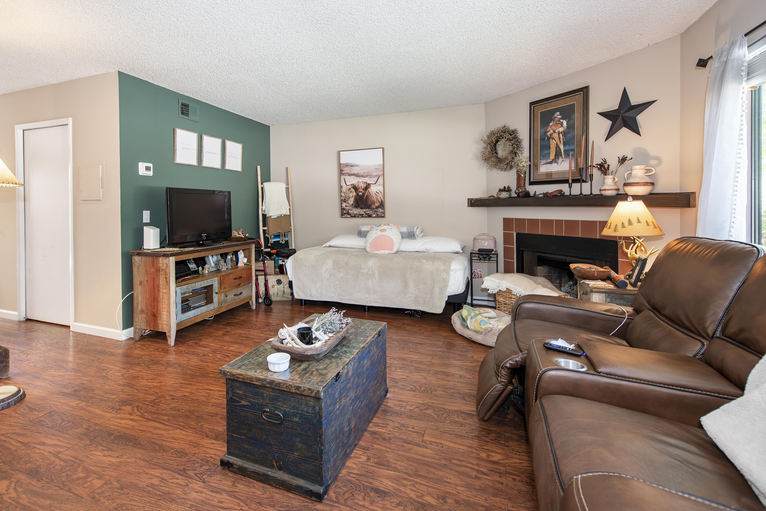 214 North R Street Lompoc, CA 93436 - Photo 2 of 15 a living room with furniture and a fireplace